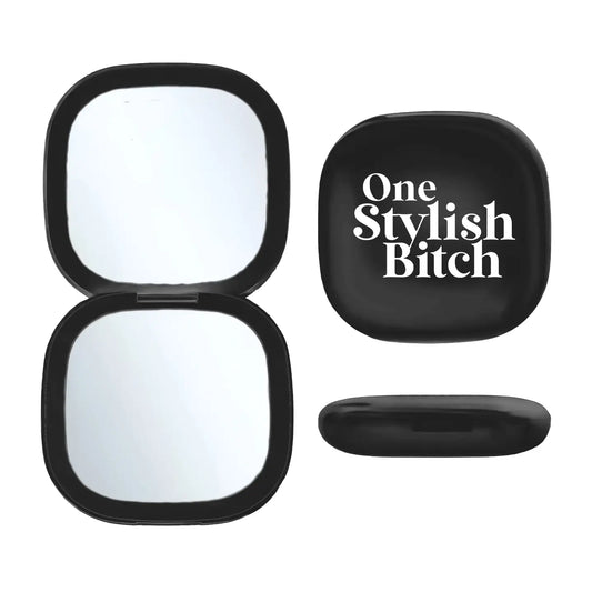 LED Compact Mirror with 'One Stylish Bitch' text, portable with USB rechargeable light and dual mirrors.