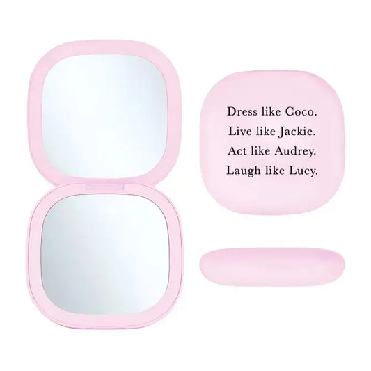 LED light-up makeup mirror with 'Dress Like Coco, Live Like Jackie, Act Like Audrey, Laugh Like Lucy' inspirational phrase for timeless beauty and elegance