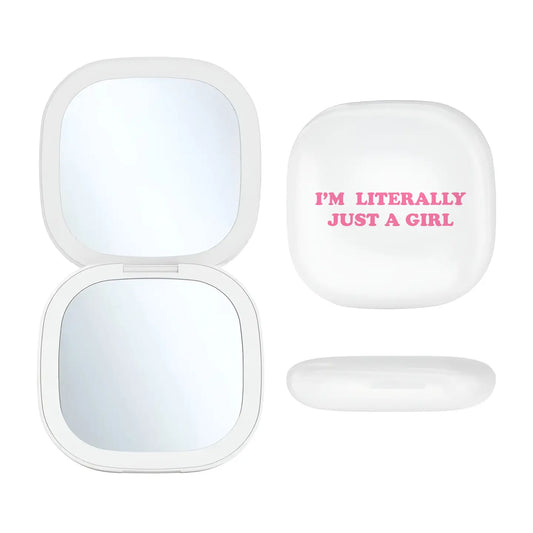 LED light-up mirror with 'I'm Literally Just a Girl' phrase, perfect for quick touch-ups and daily beauty routines.